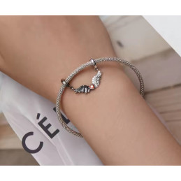 Charm double aile d'ange noir blanc pierre rouge